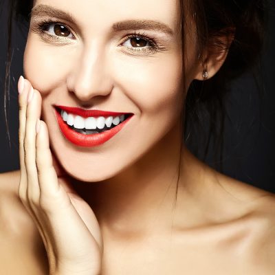 glamour portrait of beautiful  woman model lady with fresh daily makeup with red lips and clean face and romantic wavy hairstyle.